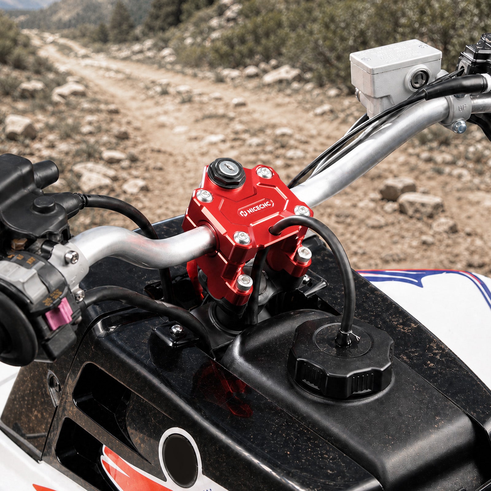 1,25" styrforhøjelse med tændingslåsholder til Yamaha Banshee 350